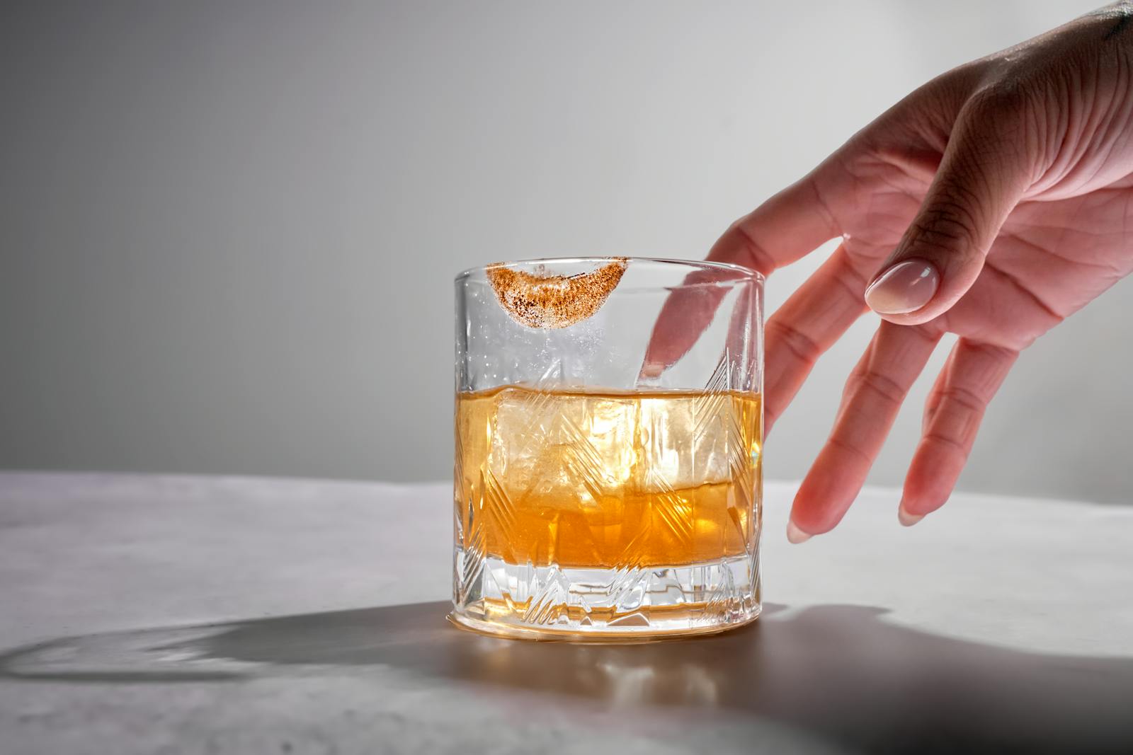 A citrus-garnished non-alcoholic drink served over ice